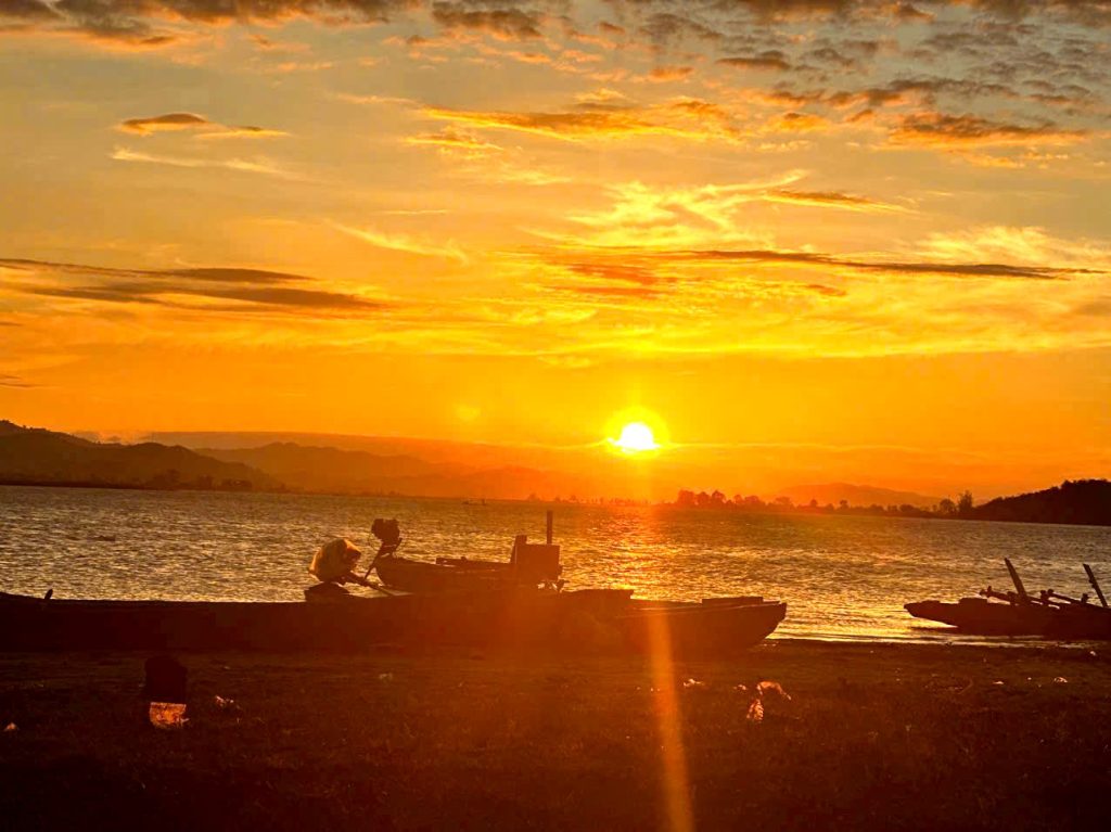 Sunset over Lak Lake with a boat on the water