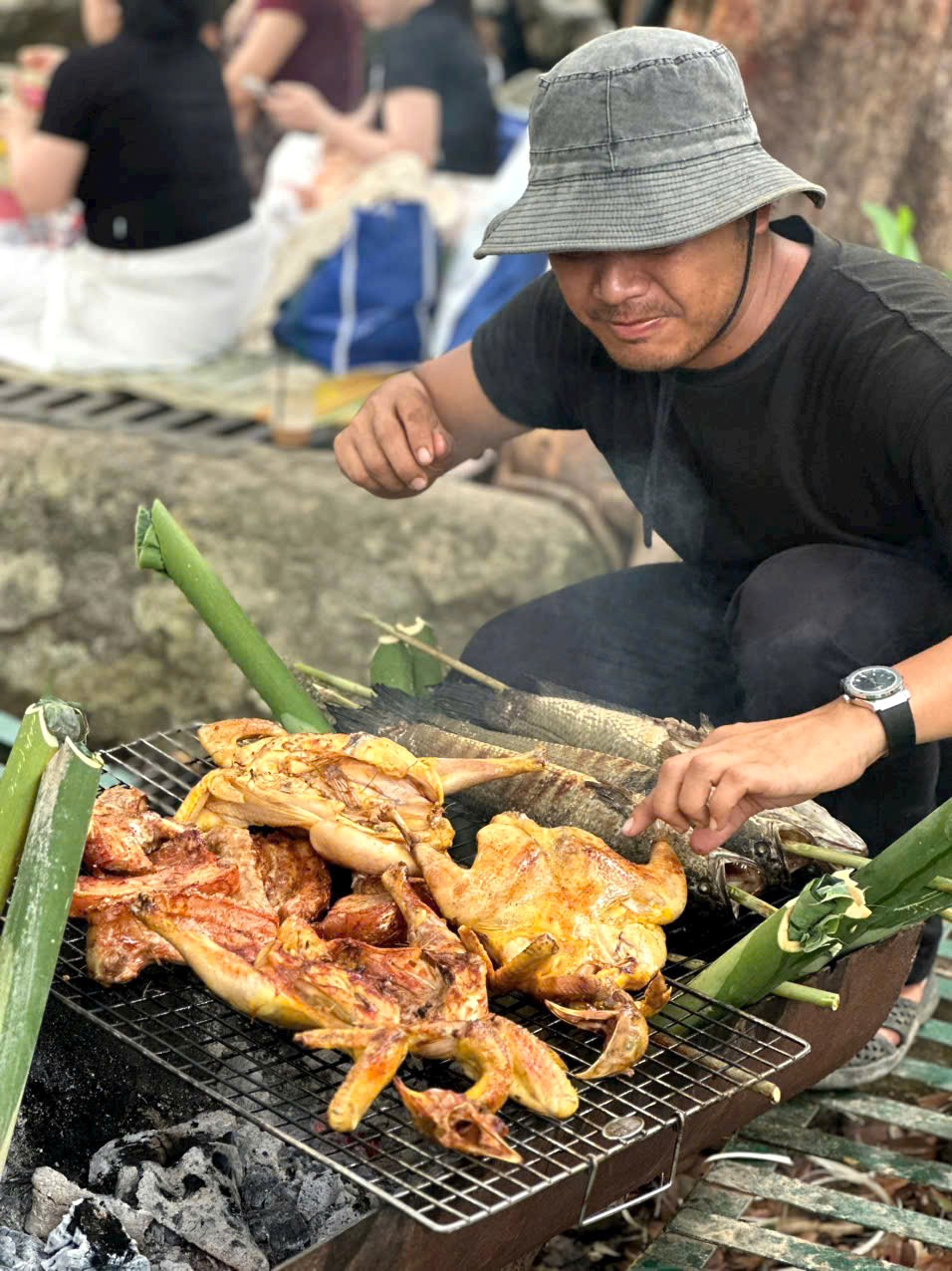Grilling local food on a homestay trip at Lak Lake
