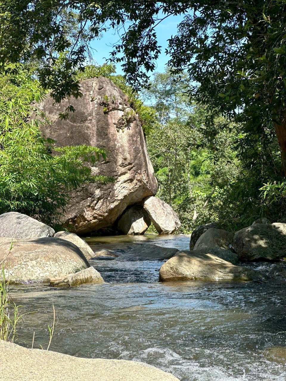 Boulders and clear water in a forest stream near Chu Yang Lak