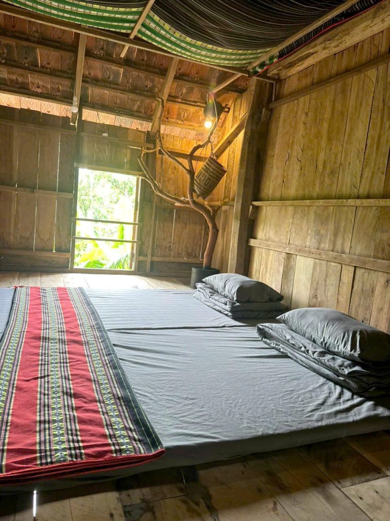 Shared sleeping room with mattresses and woven blankets